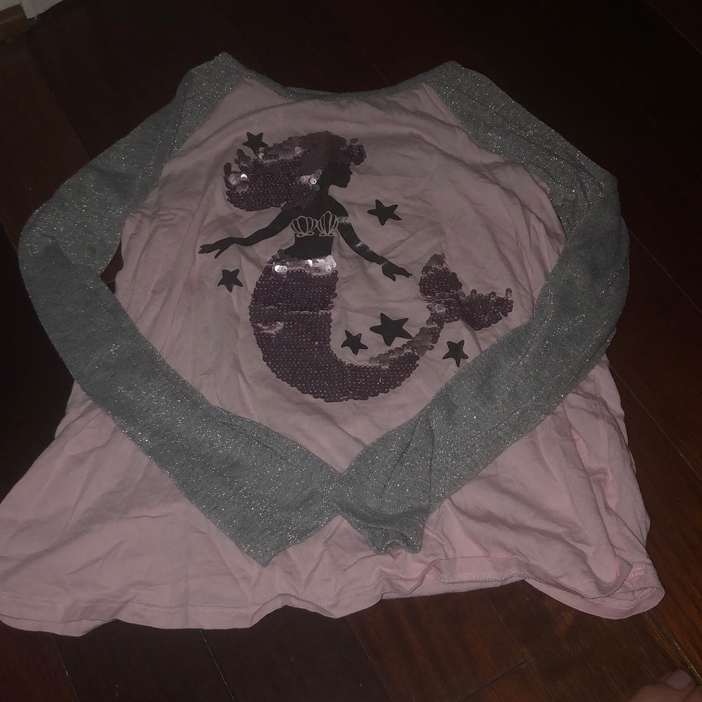 A pink long sleeve tee with a mermaid